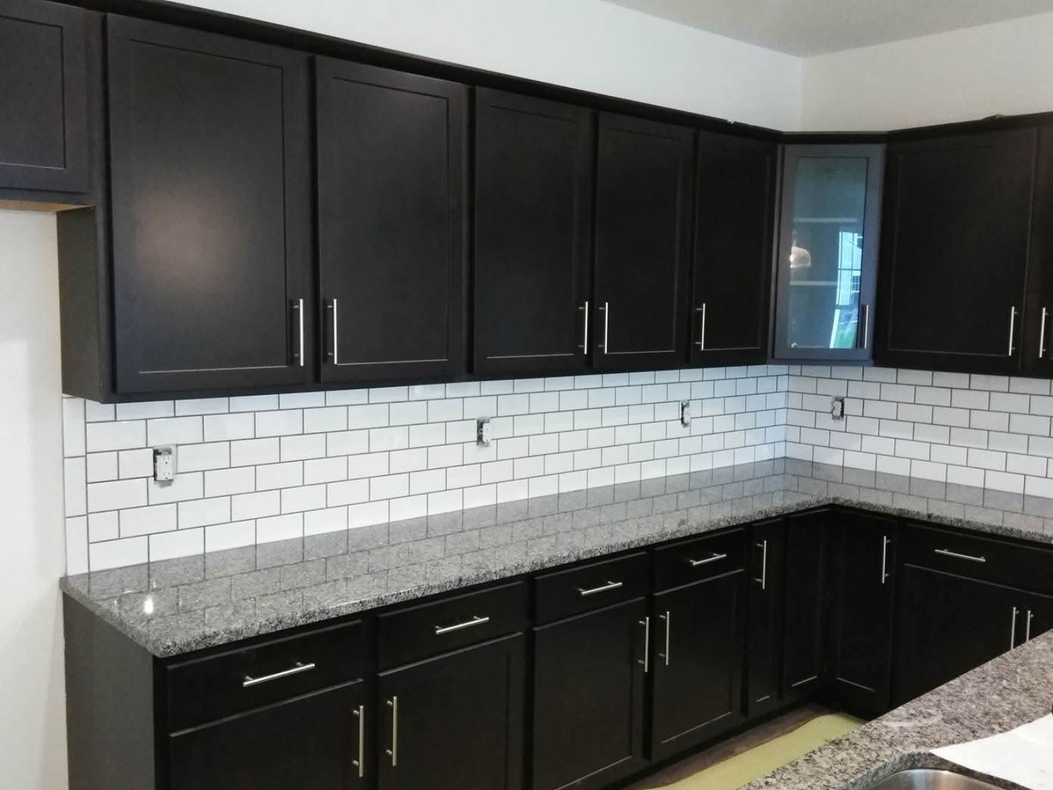 Large-format porcelain floor tile installation